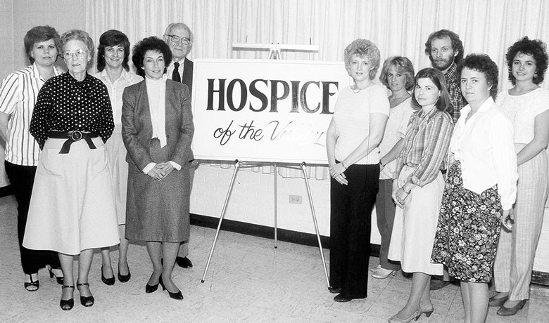 HOV staff members pose together in a black and white photo from the time the agency was founded