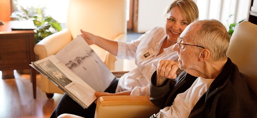 Volunteer reading to patient