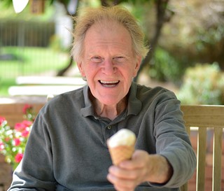 Elderly man eating ice cream