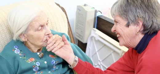 Susan Rose comforting patient