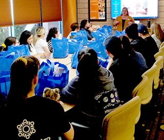Large table of students enjoying dementia training