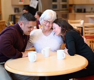 Grief support group sitting a kitchen table