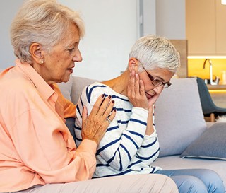 Woman helping worried woman