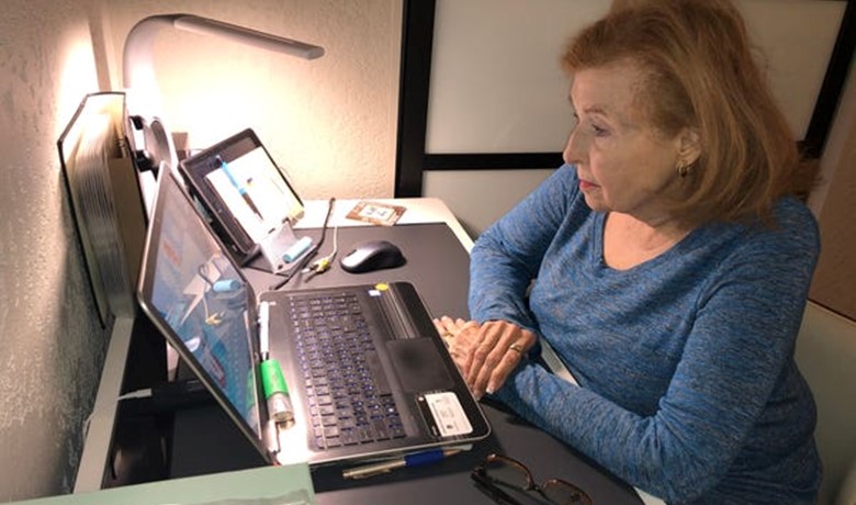 Penny Bankhead at desk with laptop