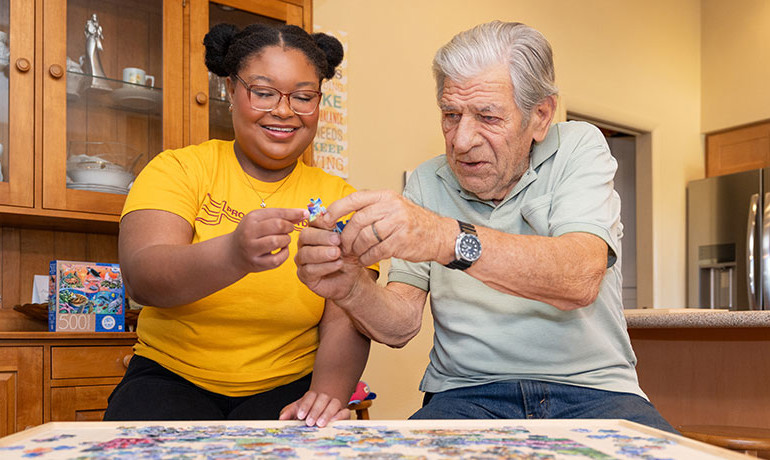 Emily-Jane Crawford and many other ASU students provide joyful connection for people like Bud Addison who are living with dementia. 