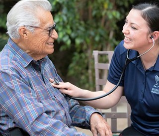 Hispanic patient Feliciano Ordonez with nurse