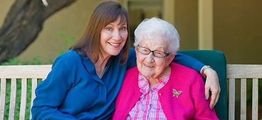 Dr. Maribeth Gallagher, director HOV's Dementia Program visits with dementia patient Sue Crawford, 100, at Gardiner Home.