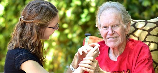 Volunteer comforting dementia patient