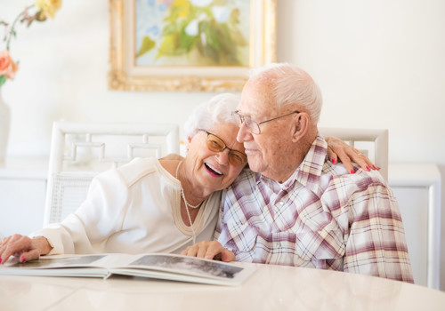 Muryl and Christiane Cole hugging while reading a book together