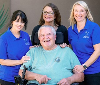 John Rosso’s respiratory needs are supported by his hospice team, nurse Lisa Dempsey, respiratory therapist Gretchen Stanton and social worker Allison Ward.
