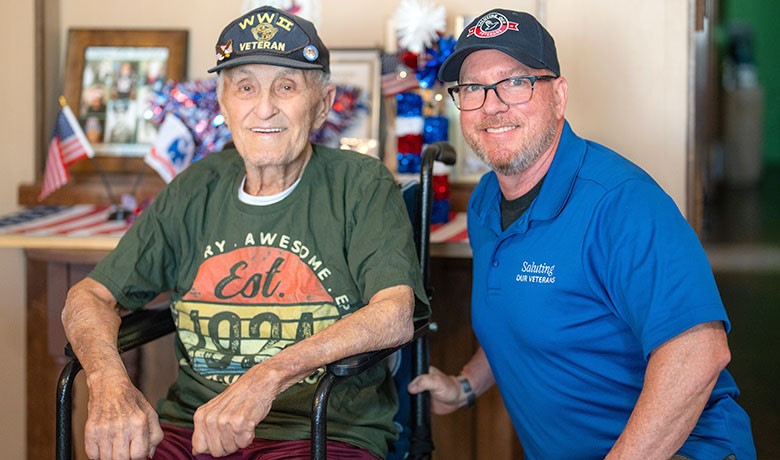 Saluting our Veterans volunteer with a veteran