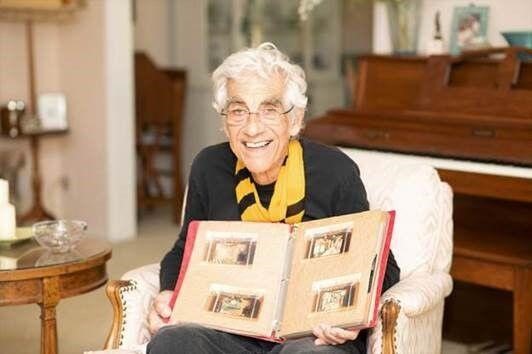 Paul Corbani holding photo album