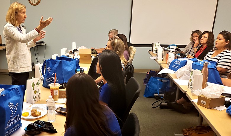 Gill Hamilton leads a group of HOV employees at a dementia experience workshop
