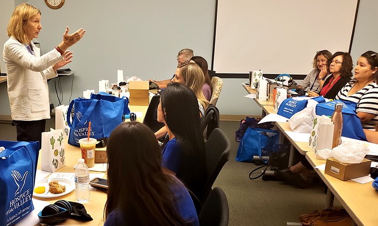 Gill Hamilton leads a group of HOV employees at a dementia experience workshop