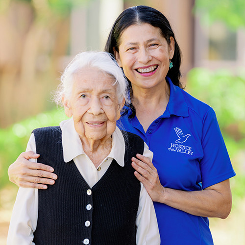 RN Gloria Curtis comforting patient Pilar