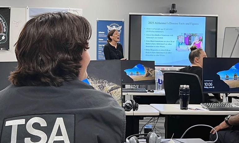 Hospice of the Valley occupational therapist Calli Carlson leads Dementia Moments training for Sky Harbor TSA agents in Phoenix.