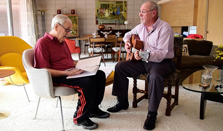 Music therapy patient and instructor playing music