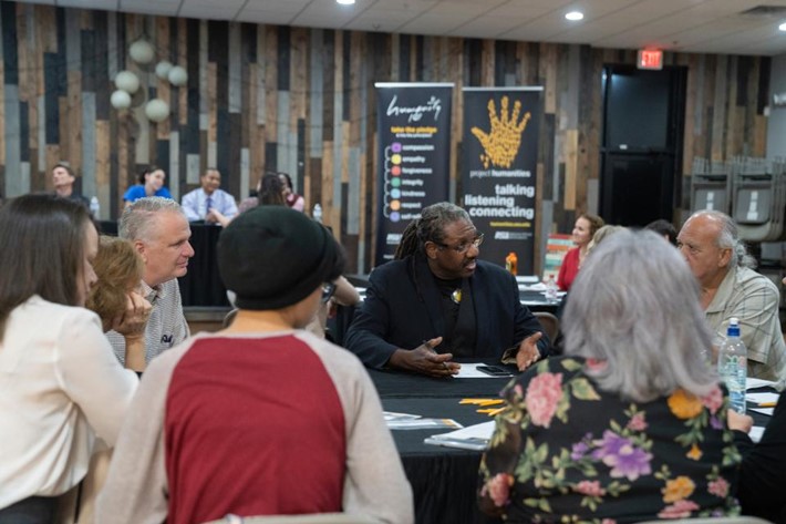 Neal Lester in discussion with a group of attendees