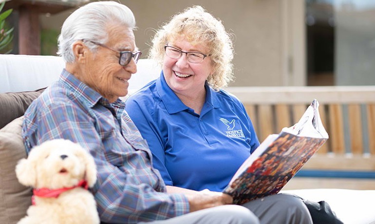 Dementia activities coordinator Gail Higginbotham, CNA, with patient Feliciano Ordonez.