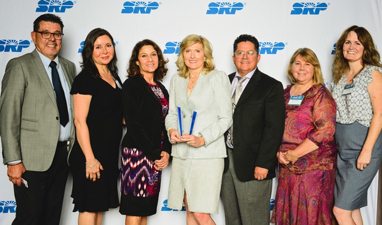 HOV leadership poses with award
