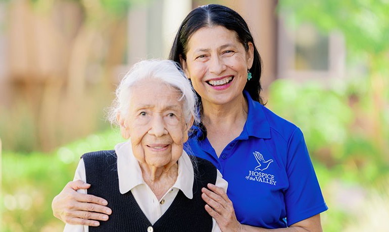 HOV patient Pilar smiling with her nurse