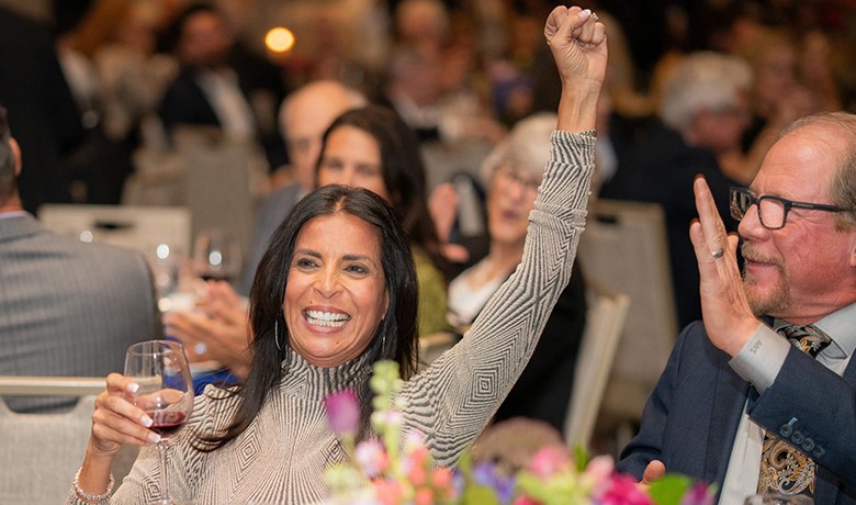 Mona and Kelly Sands celebrate an auction win