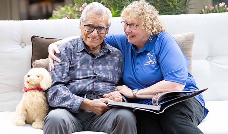 Dementia activities coordinator Gail Higginbotham, CNA, with patient Feliciano Ordonez