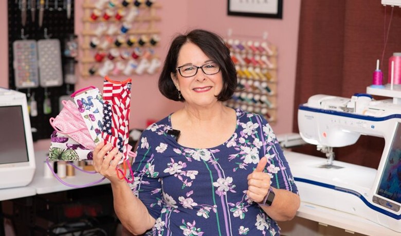 Linda Miller holding a variety of face masks
