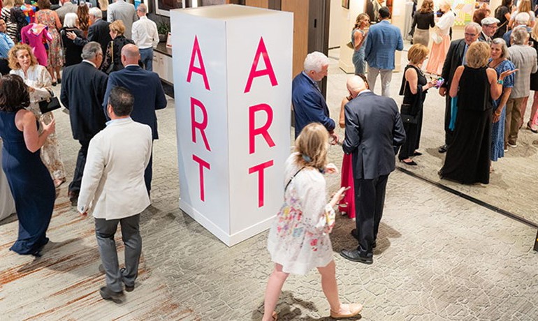 People walking about art gallery at aaha annual event