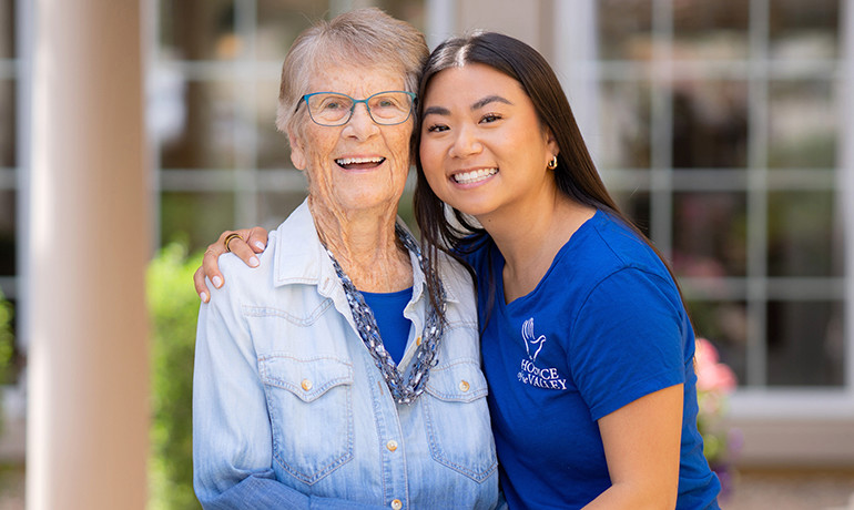 Social Worker Laura Cross with patient Mildred hugging