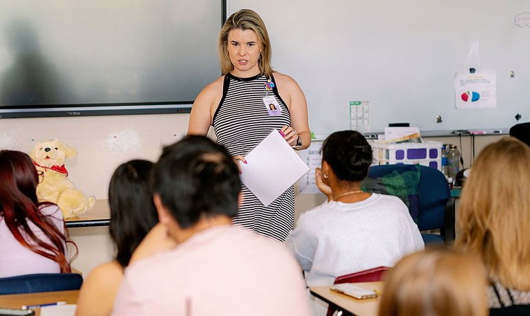 Helena Morgan speaking to a classroom of high school students