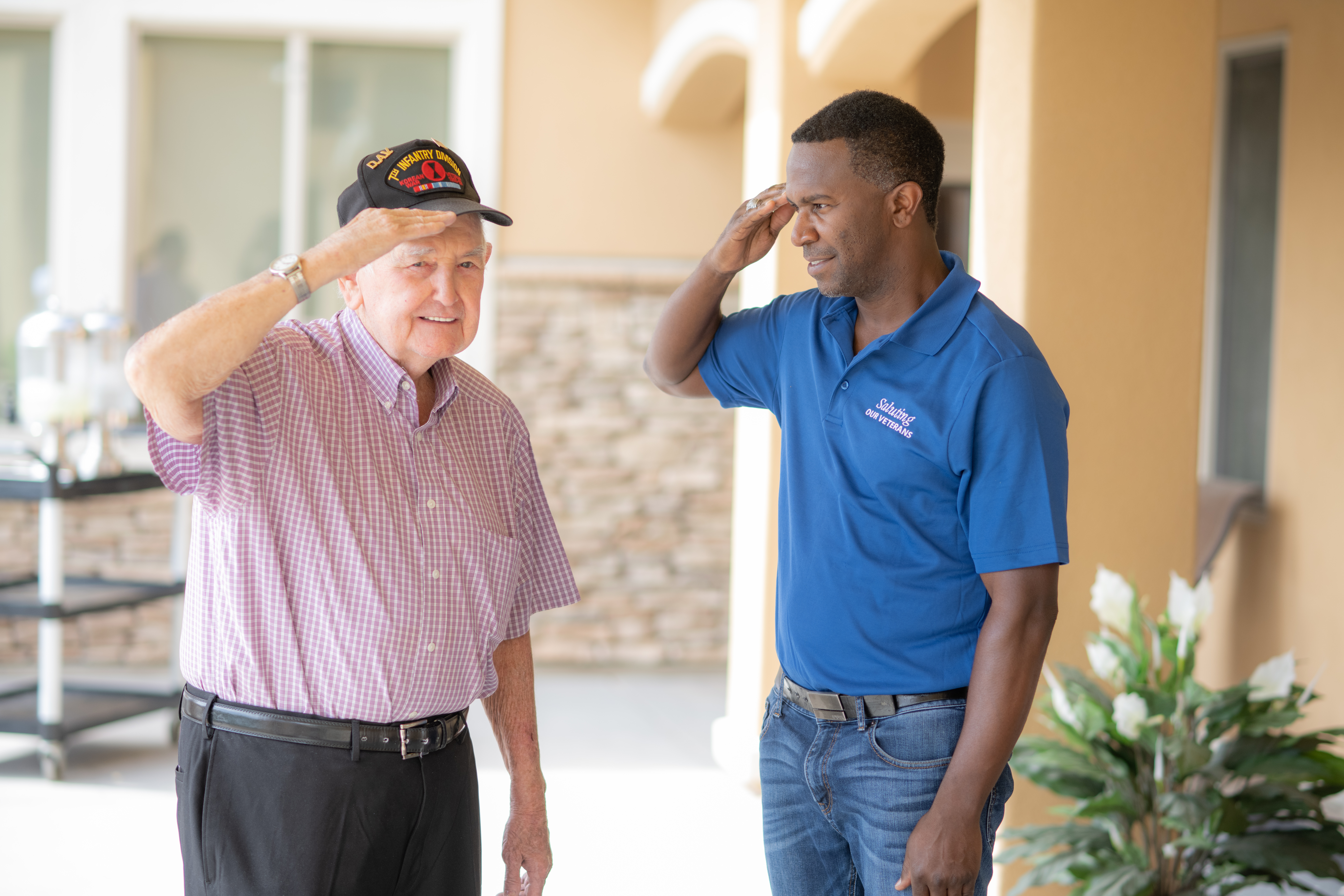 Saluting our Veterans volunteer with a veteran