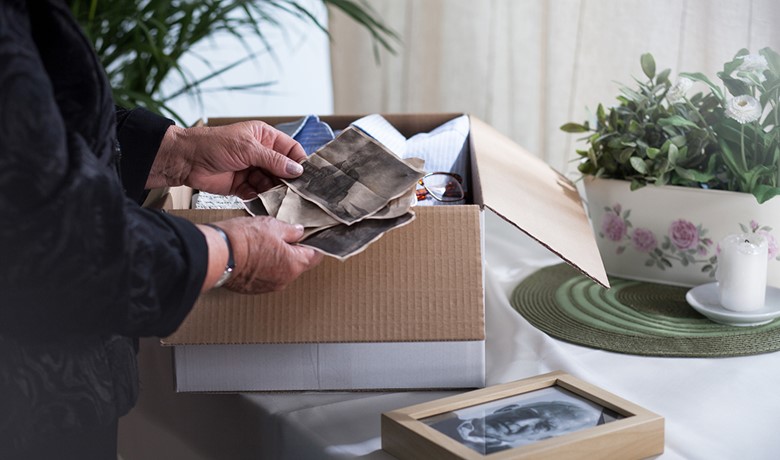 Person sorting through old photos