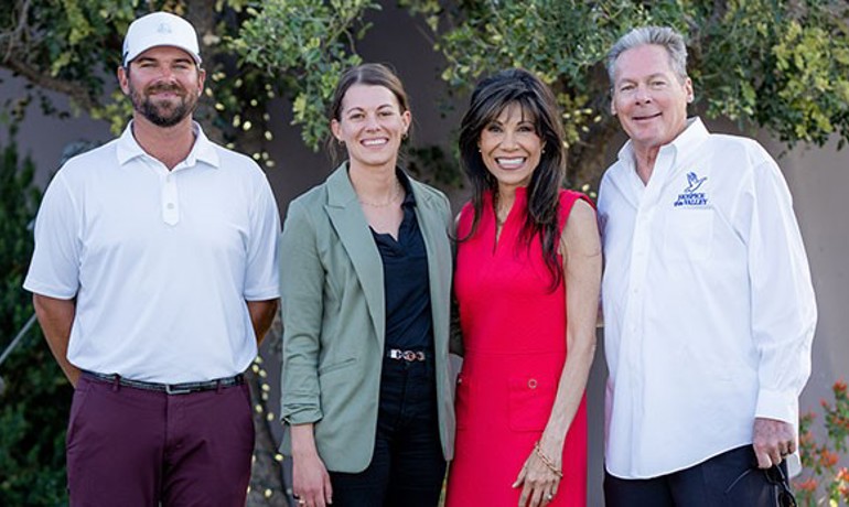 Michael Ressa, Bethany Persch, Joe Solien, Jay Hoselton, and Lin Sue Cooney standing in front of leader board