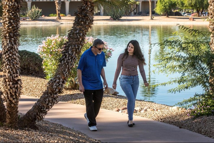 John O'Donnell and Arabella Yousif walking together outside