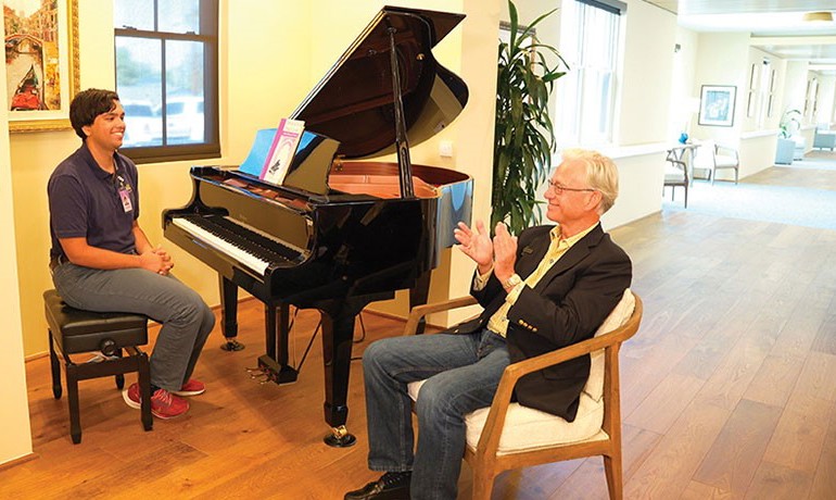 Steve Harnden applauds a volunteer pianist at the HOV Dementia Care and Education Campus